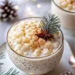 A bowl of Festive Eggnog Tapioca Delight topped with whipped cream and sprinkled with ground nutmeg, garnished with a cinnamon stick.