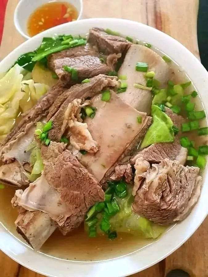 Hearty Filipino Beef Nilaga soup with tender beef ribs, vegetables, and a flavorful broth.